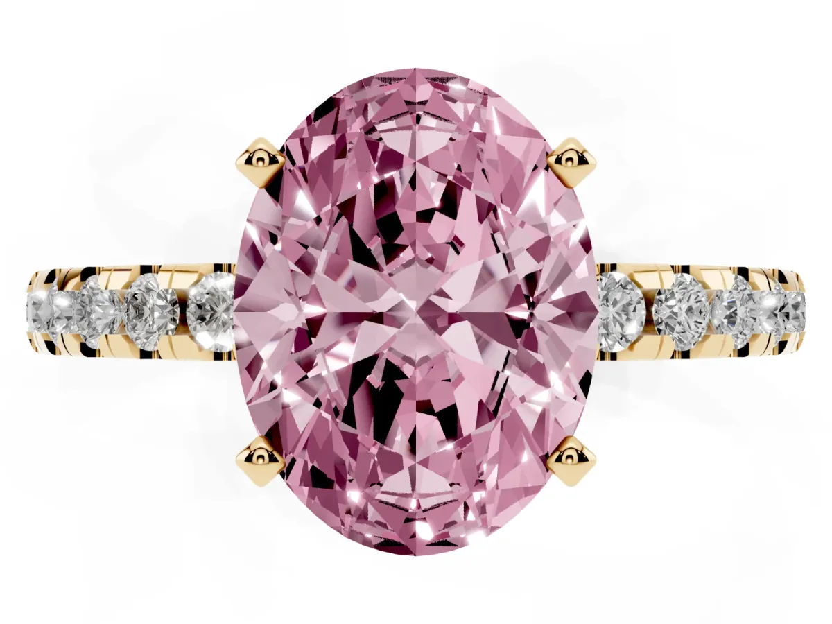 Fancy Pink Oval Cut Diamond Solitaire Ring with Round Pavé Band and Four-Prong Setting Yellow gold