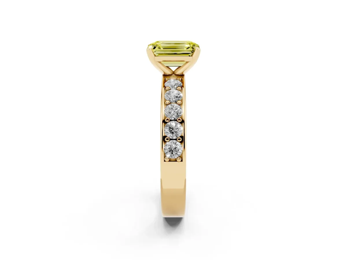 Fancy Yellow Emerald Cut Diamond Engagement Ring with Channel Set Round Band and Prong Setting Yellow gold
