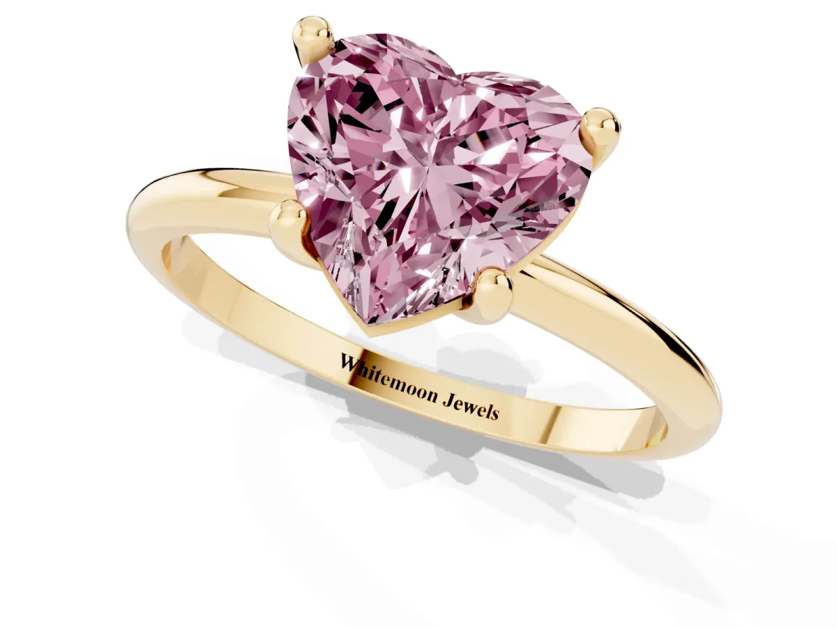 Fancy Pink Heart Cut Solitaire Diamond Ring with 4-Prong Setting on a Classic Band Yellow gold