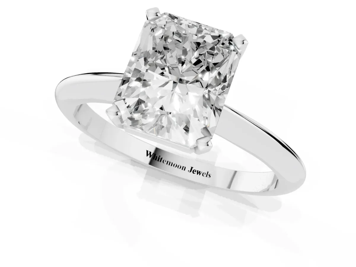 Radiant Cut Cut Solitaire Ring with Four-Prong Setting on a Classic Band Platinum