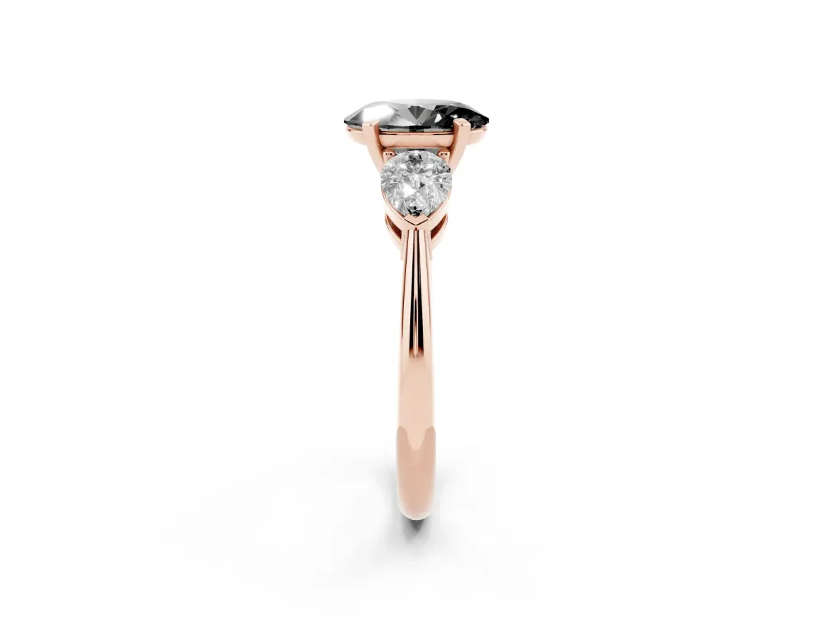 Fancy Black Three-Stone Oval Cut Diamond Ring with Pear Side Stones and Four-Prong Setting Rose gold