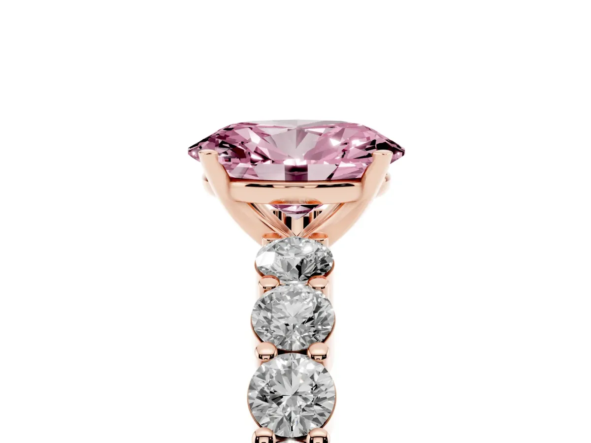 Fancy Pink Oval Cut Diamond Solitaire Ring with Shared Prong Round Side Stones Rose gold