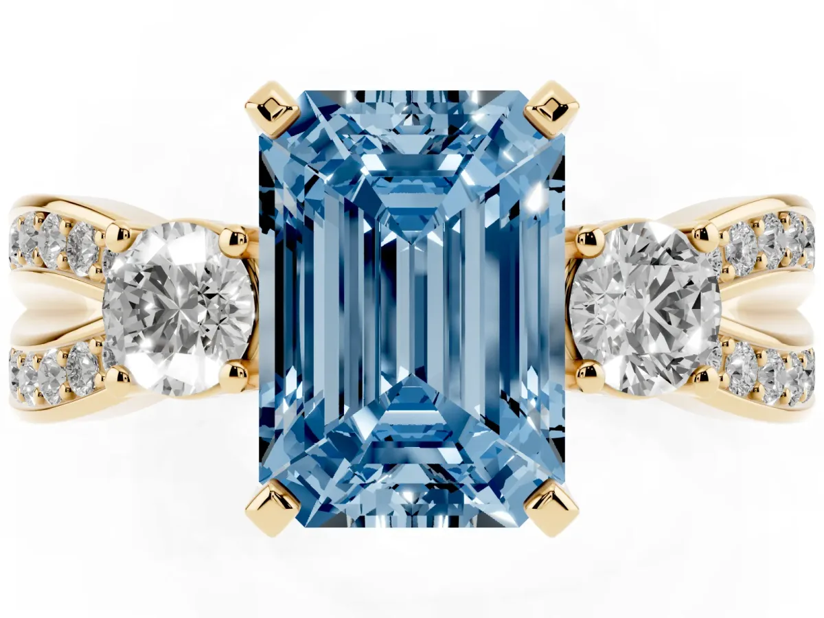 Fancy Blue Three-Stone Emerald Cut Cut Diamond Twist Band with Prong Setting Yellow gold