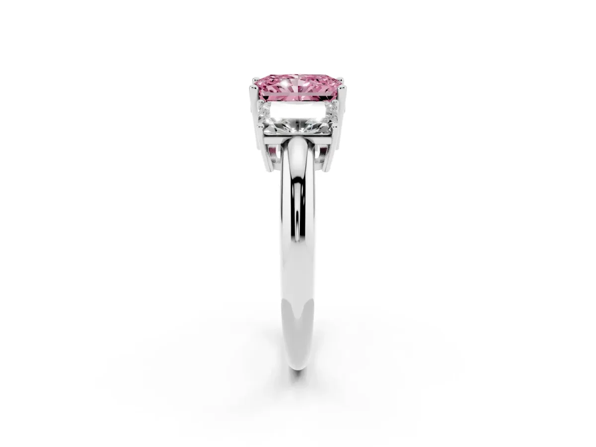 Fancy Pink Three-Stone Radiant Cut Cut Diamond Engagement Ring with Prong Setting on a White Gold Band Platinum