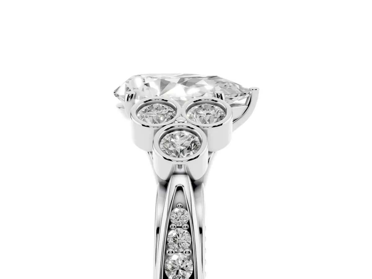 Pear Cut Cut Diamond Engagement Ring with Bezel Set Round Side Stones and Prong Setting Silver