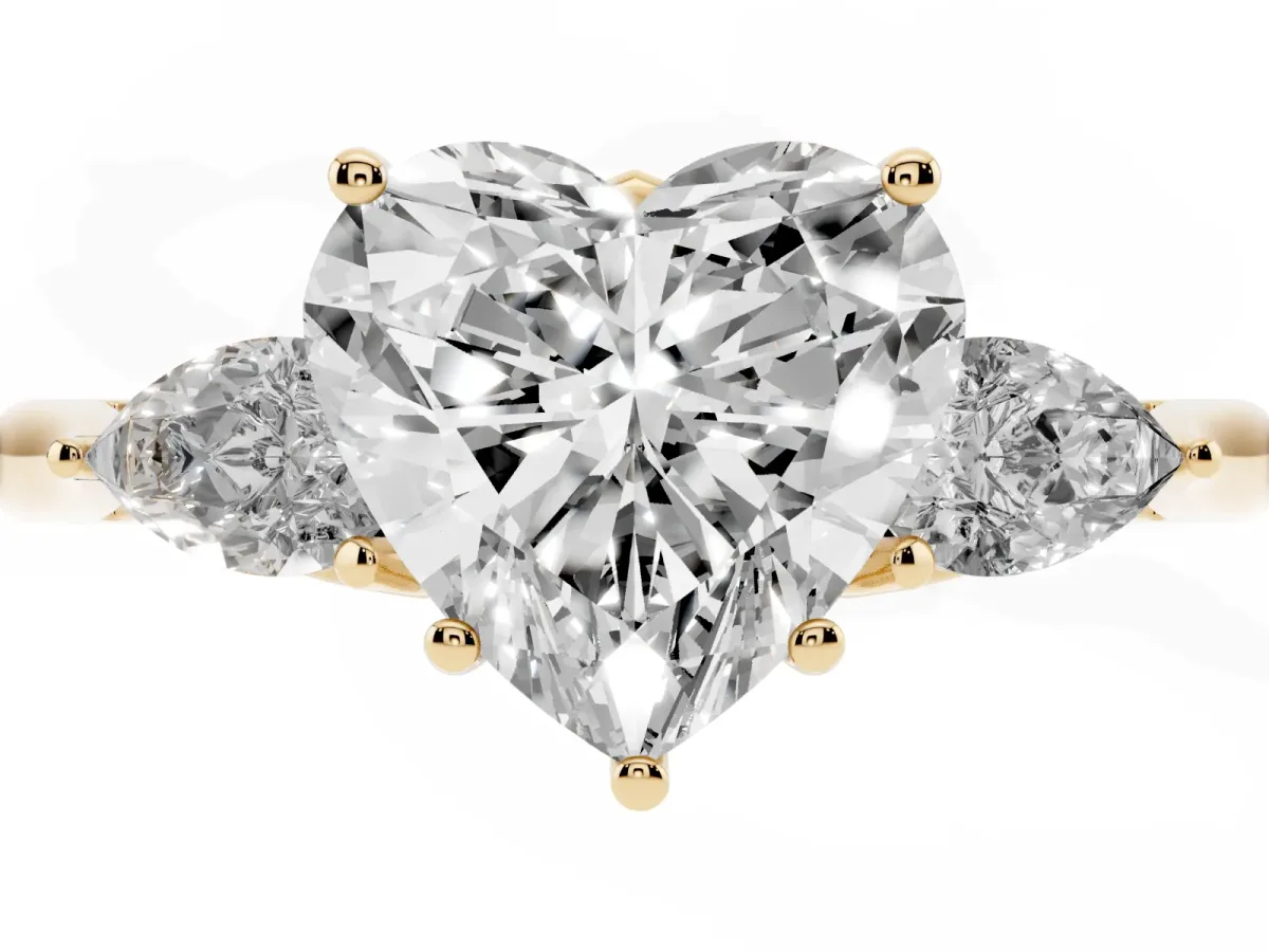 Heart Cut Diamond Three-Stone Ring with Pear Side Stones and Prong Setting Yellow gold