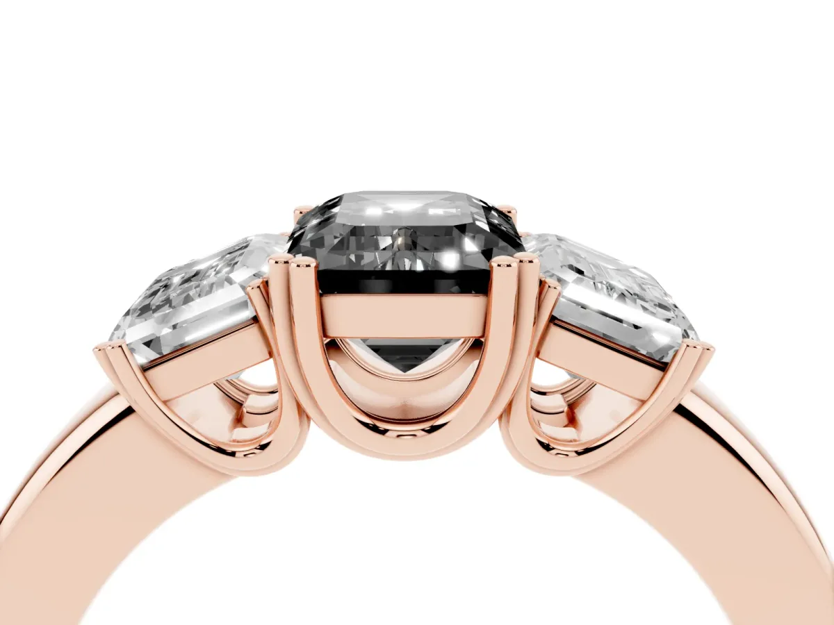 Fancy Black Three-Stone Emerald Cut Cut Diamond Ring with Channel Set Band and Four-Prong Setting Rose gold