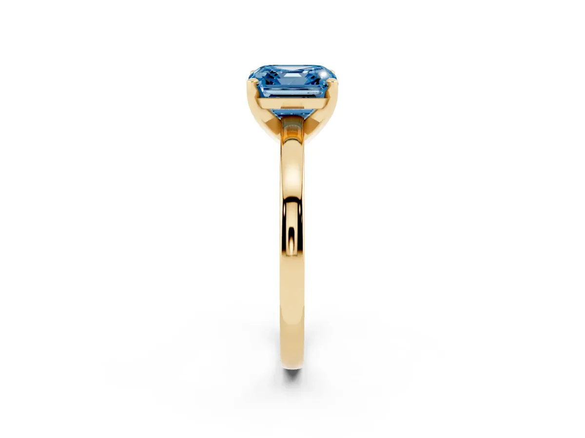 Fancy Blue Asscher Cut Solitaire Diamond Engagement Ring with Four-Prong Setting on a Classic Band Yellow gold