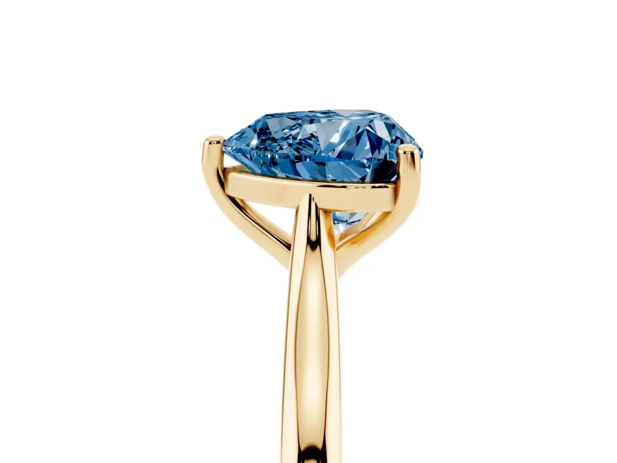 Fancy Blue Heart Cut Cut Solitaire Ring with Cathedral Band and Four-Prong Setting Yellow gold