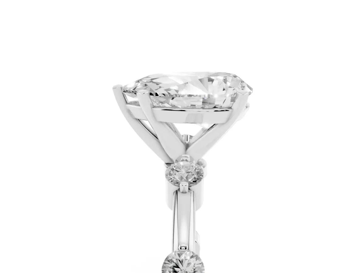 Pear Cut Solitaire Diamond Ring with Bezel Set Side Stones and Prong Setting White gold