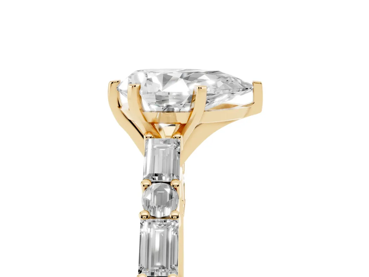 Pear Cut Diamond Solitaire with Side Baguettes and Channel Set Band Yellow gold