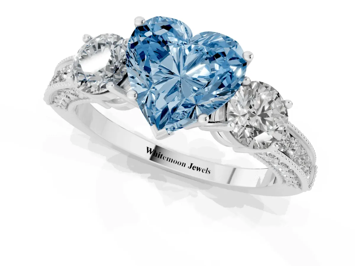 Fancy Blue Heart Cut Three-Stone Diamond Ring with Pavé Band and Four-Prong Setting Silver
