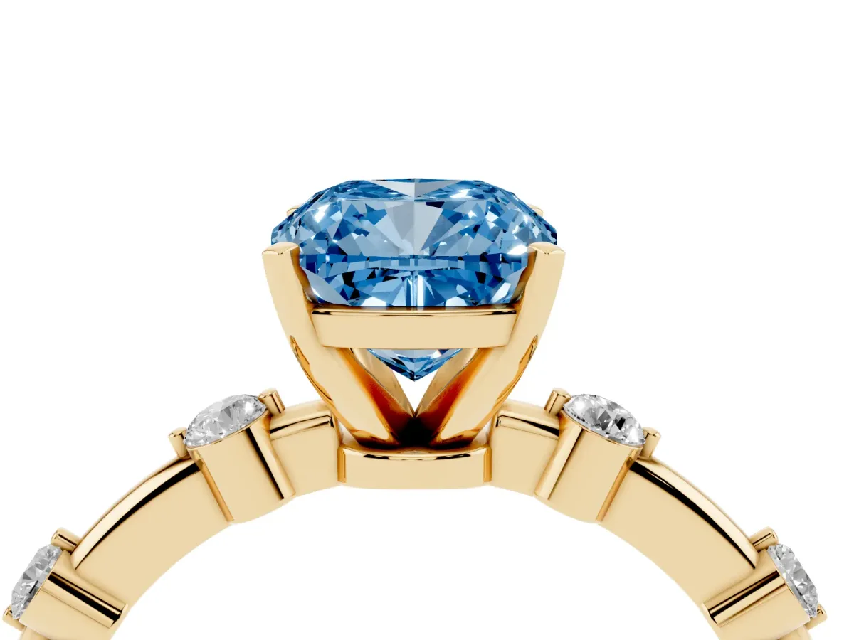 Fancy Blue Cushion Cut Solitaire Diamond Ring with Bezel Set Side Stones and Prong Setting Yellow gold