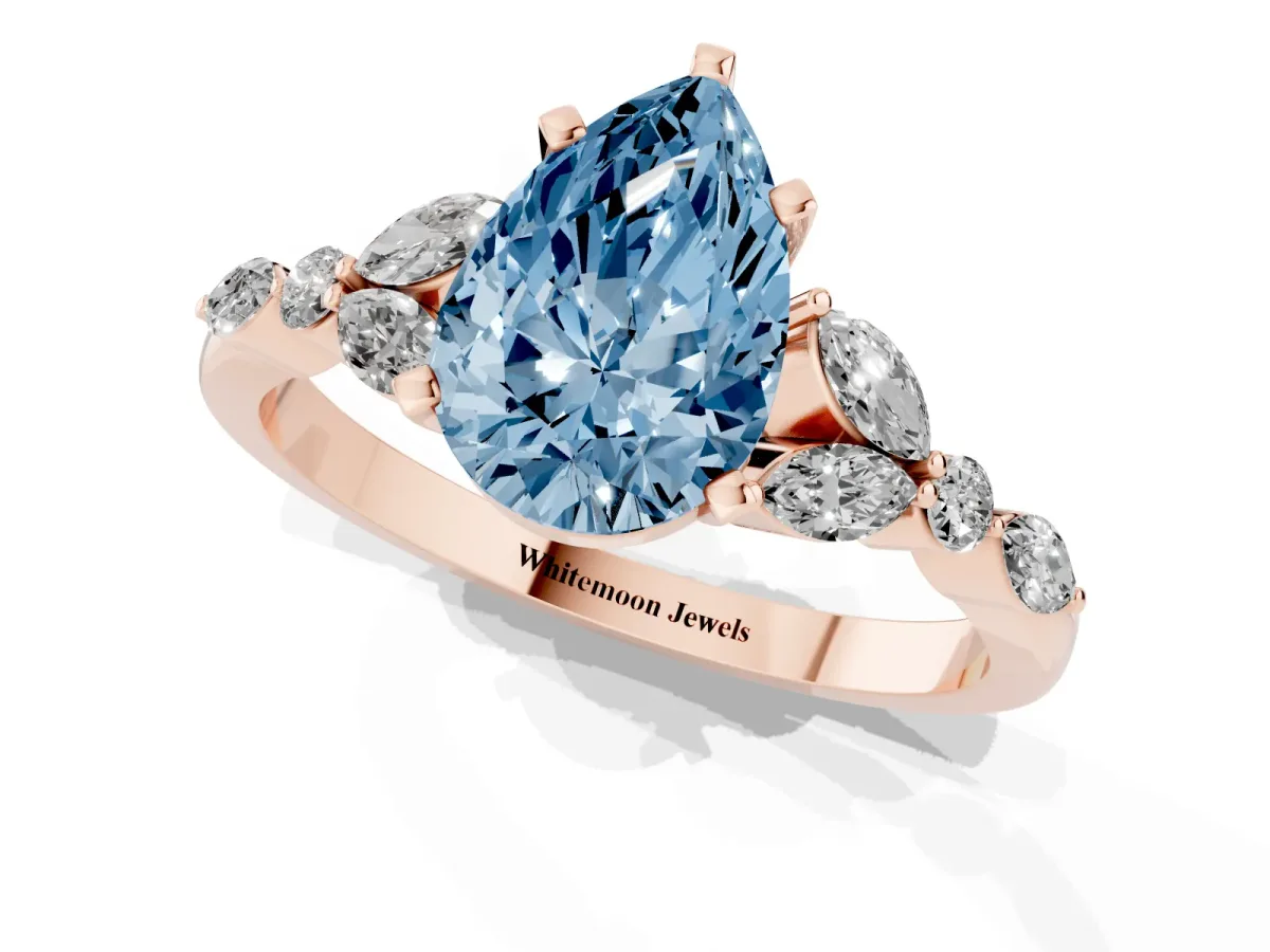 Fancy Blue Pear Cut Diamond Solitaire Ring with Side Stones and Four-Prong Setting Rose gold