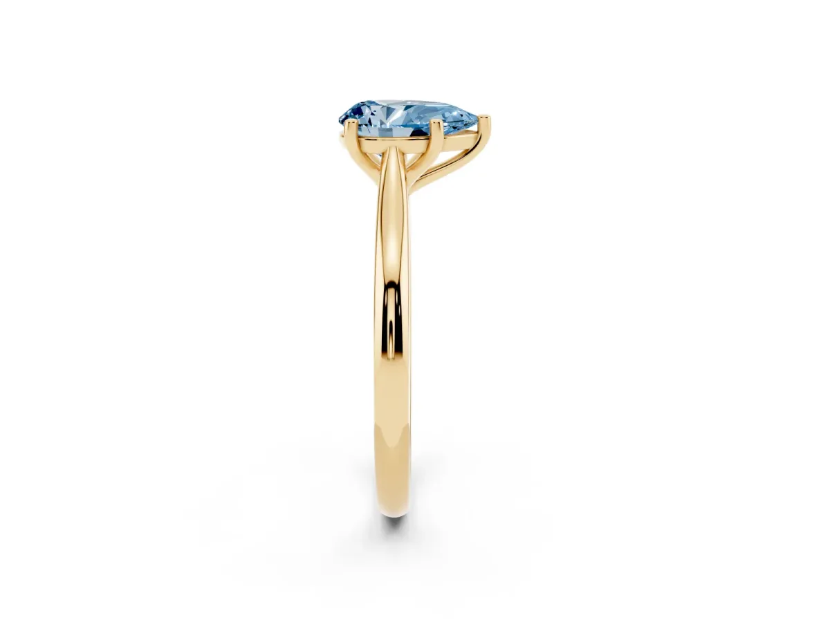 Fancy Blue Pear Cut Cut Solitaire Ring with Cathedral Band and Four-Prong Setting Yellow gold