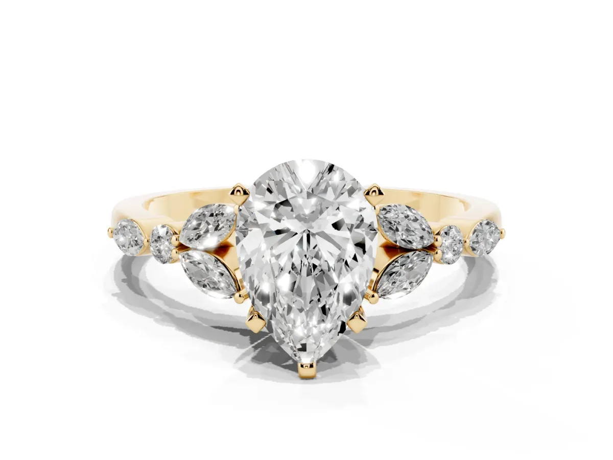 Pear Cut Diamond Solitaire Ring with Side Stones and Four-Prong Setting Yellow gold
