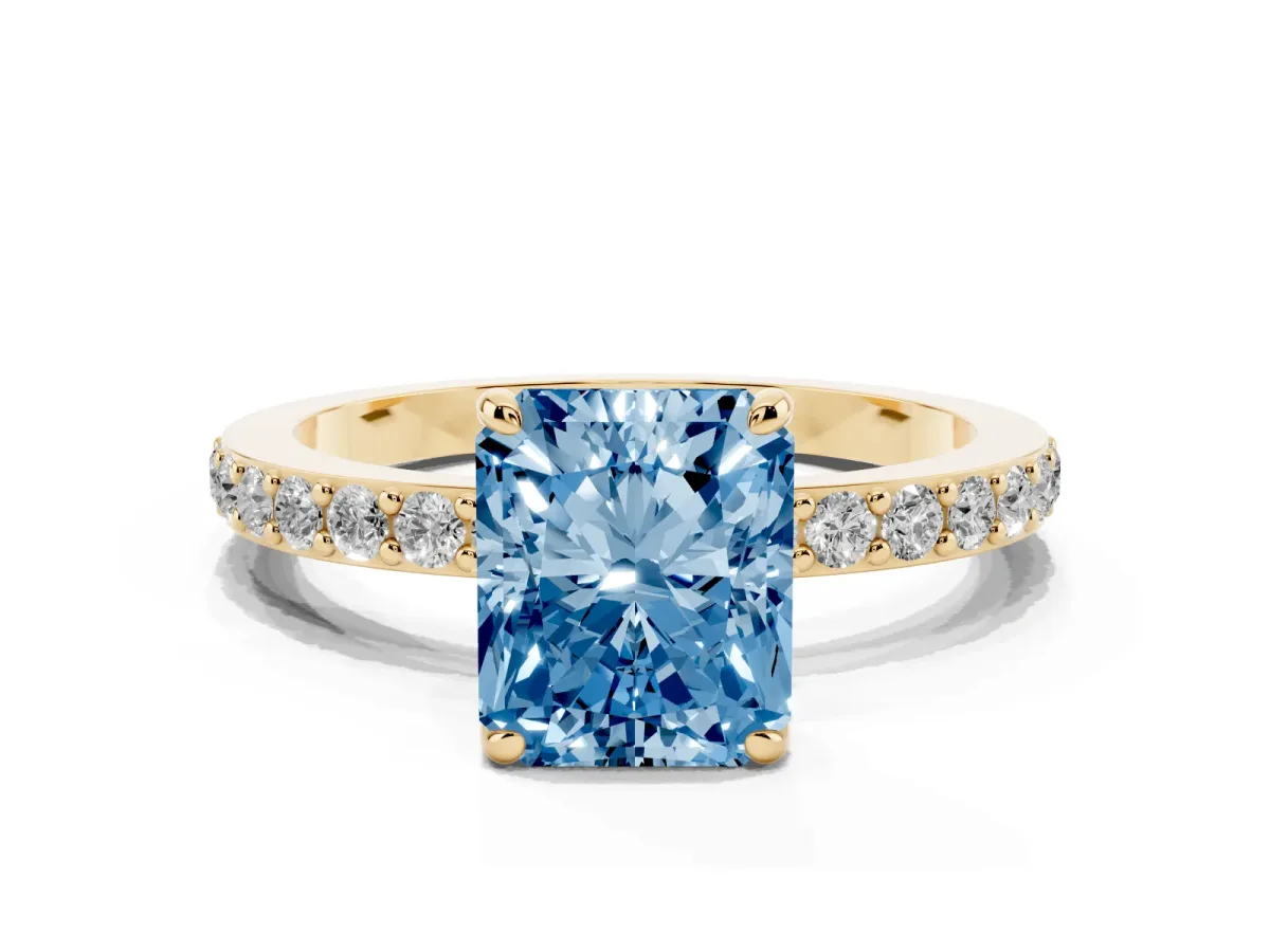 Fancy Blue Radiant Cut Diamond Pavé Engagement Ring with Round Accents and Prong Setting Yellow gold