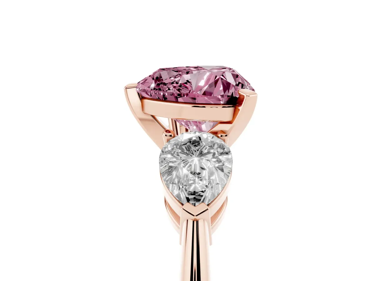 Fancy Pink Three-Stone Heart Cut Diamond Ring with Pear Side Stones and Four-Prong Setting Rose gold