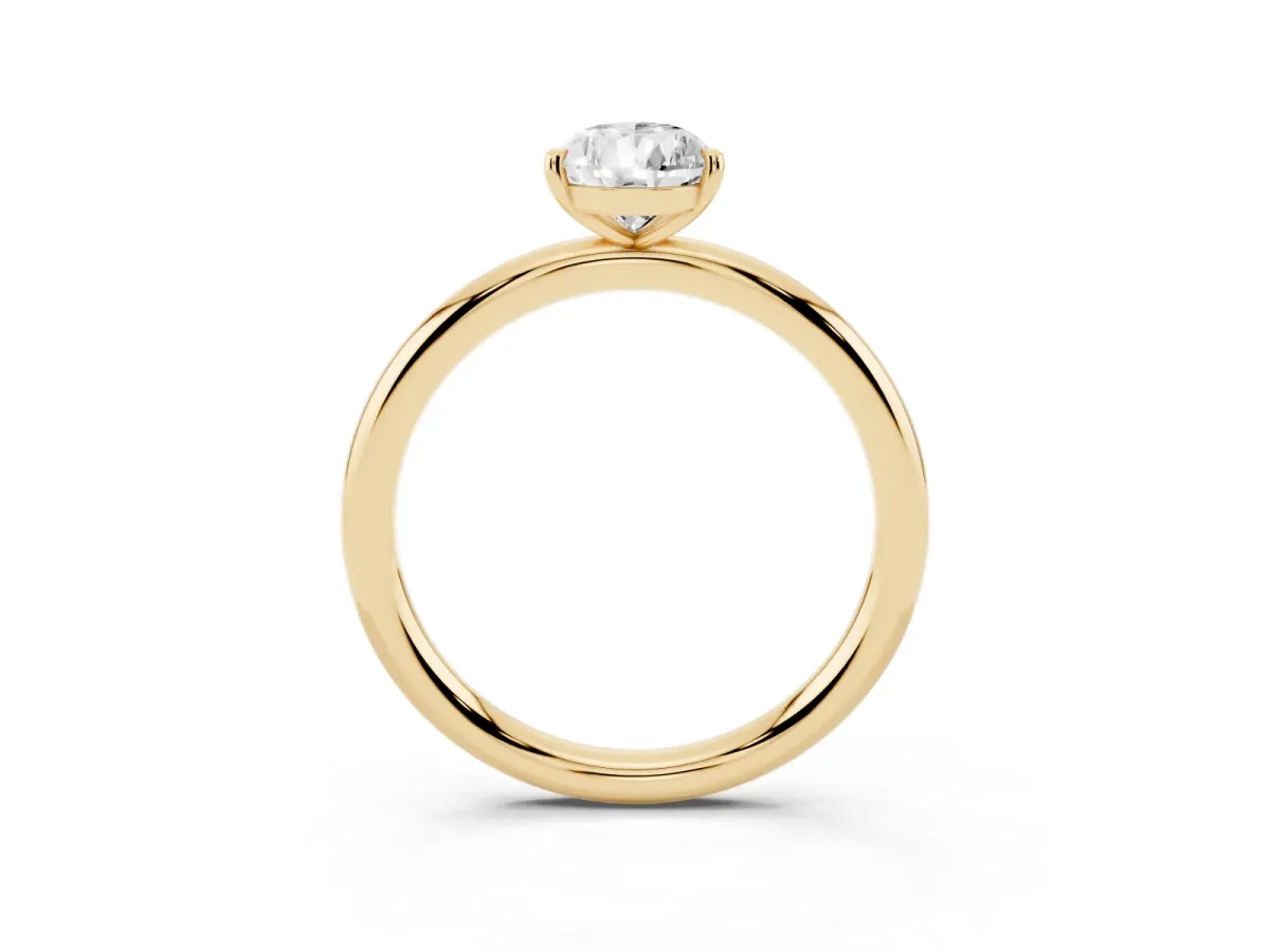 Pear Cut Solitaire Diamond Ring with Four-Prong Setting on a Plain Band Yellow gold