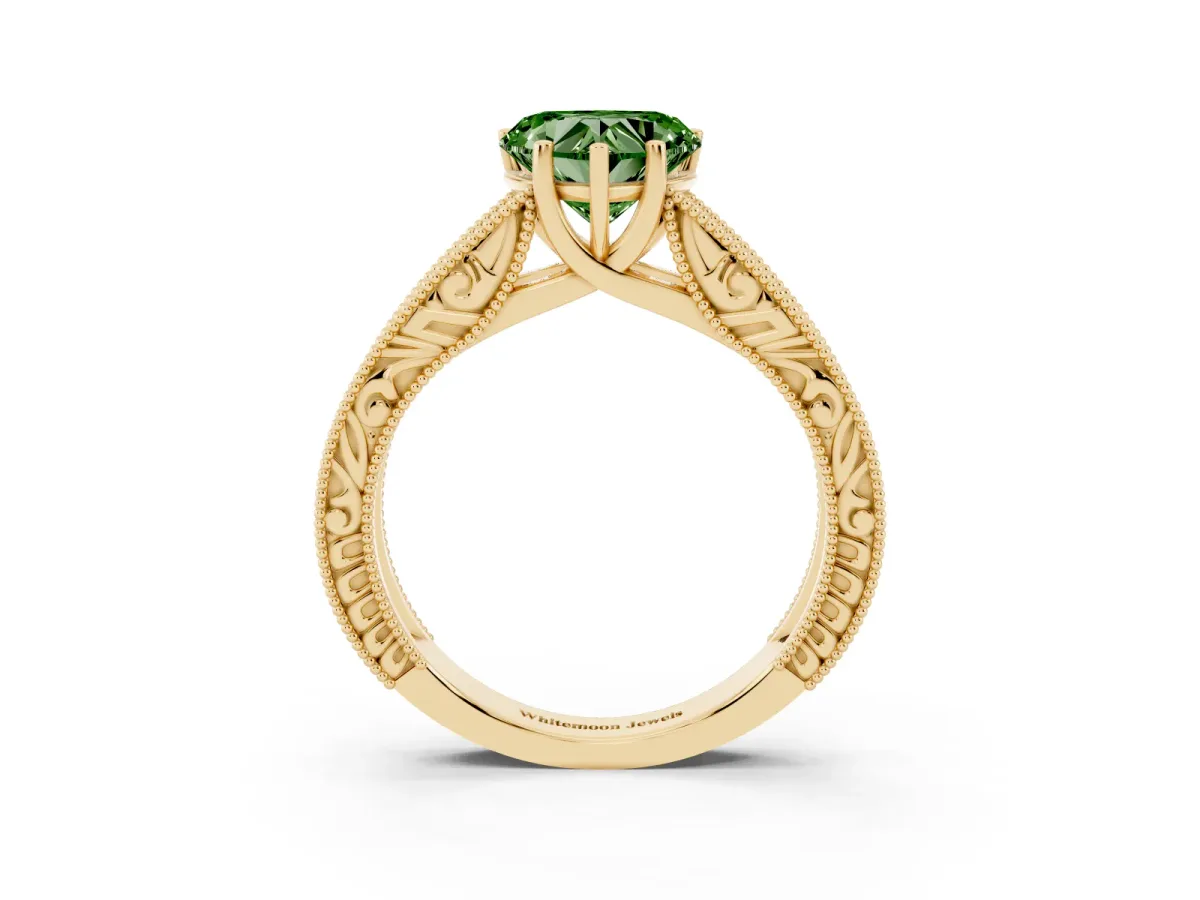 Fancy Green Heart Cut Diamond Solitaire Ring with Engraved Band and Four-Prong Setting Yellow gold