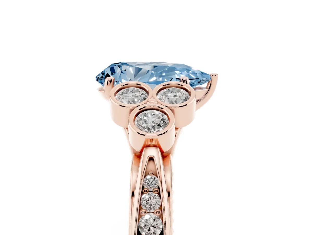 Fancy Blue Pear Cut Cut Diamond Engagement Ring with Bezel Set Round Side Stones and Prong Setting Rose gold