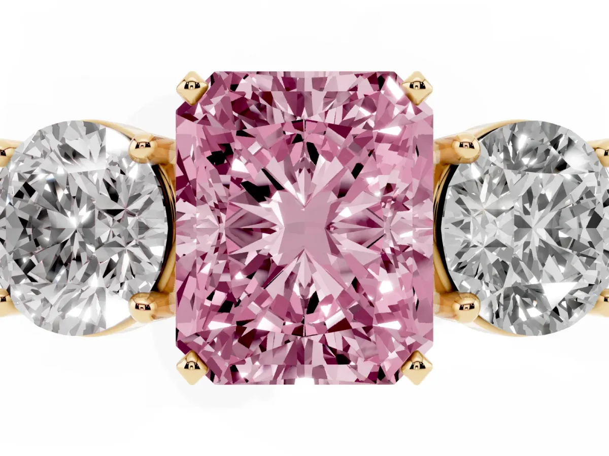 Fancy Pink Three-Stone Radiant Cut Diamond Ring with Round Side Stones, Classic Band, and Four-Prong Setting Yellow gold