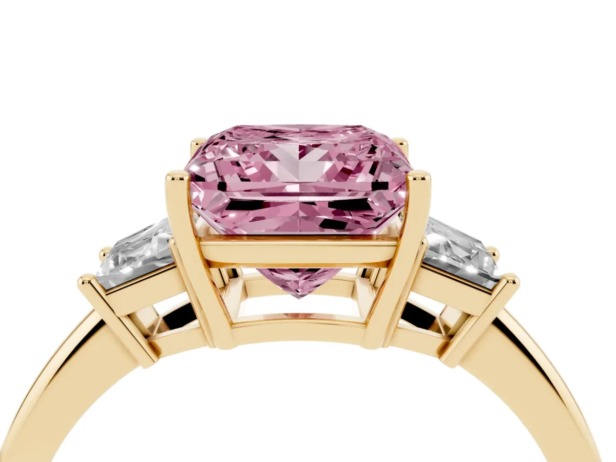 Fancy Pink Princess Cut Diamond Three-Stone Ring with Trapezoid Side Stones and Prong Setting Yellow gold