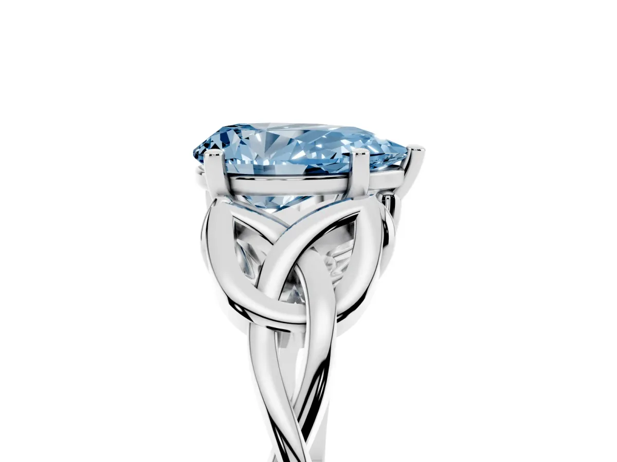 Fancy Blue Pear Cut Diamond Solitaire Engagement Ring with Celtic Knot Band and Four-Prong Setting Silver