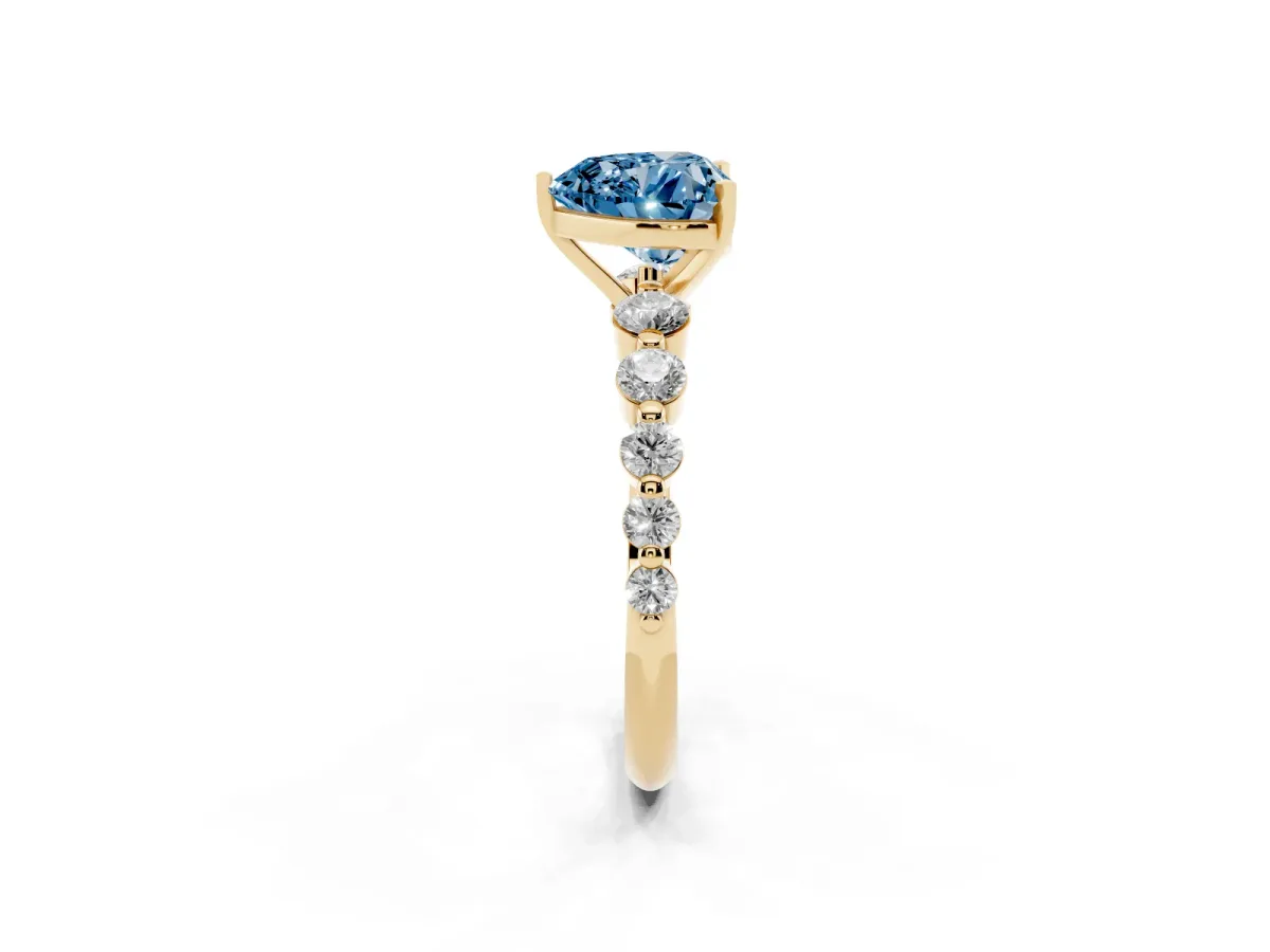 Fancy Blue Heart Cut Solitaire Diamond Ring with Pave Band and Four-Prong Setting Yellow gold