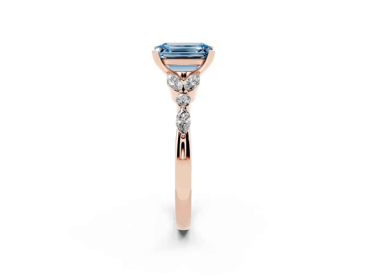 Fancy Blue Emerald Cut Diamond Solitaire Ring with Side Stones and Four-Prong Setting Rose gold