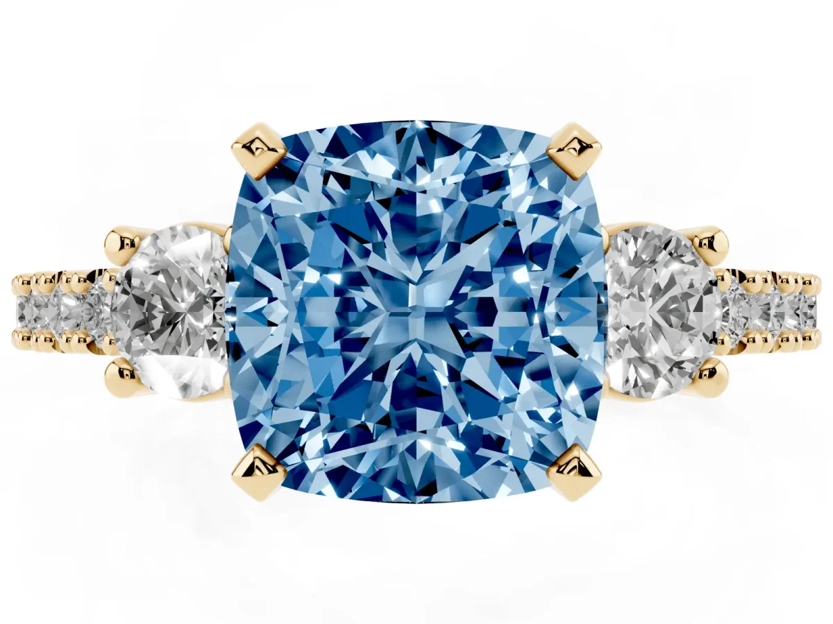 Fancy Blue Cushion Cut Three-Stone Diamond Pavé Band with Prong Setting Yellow gold