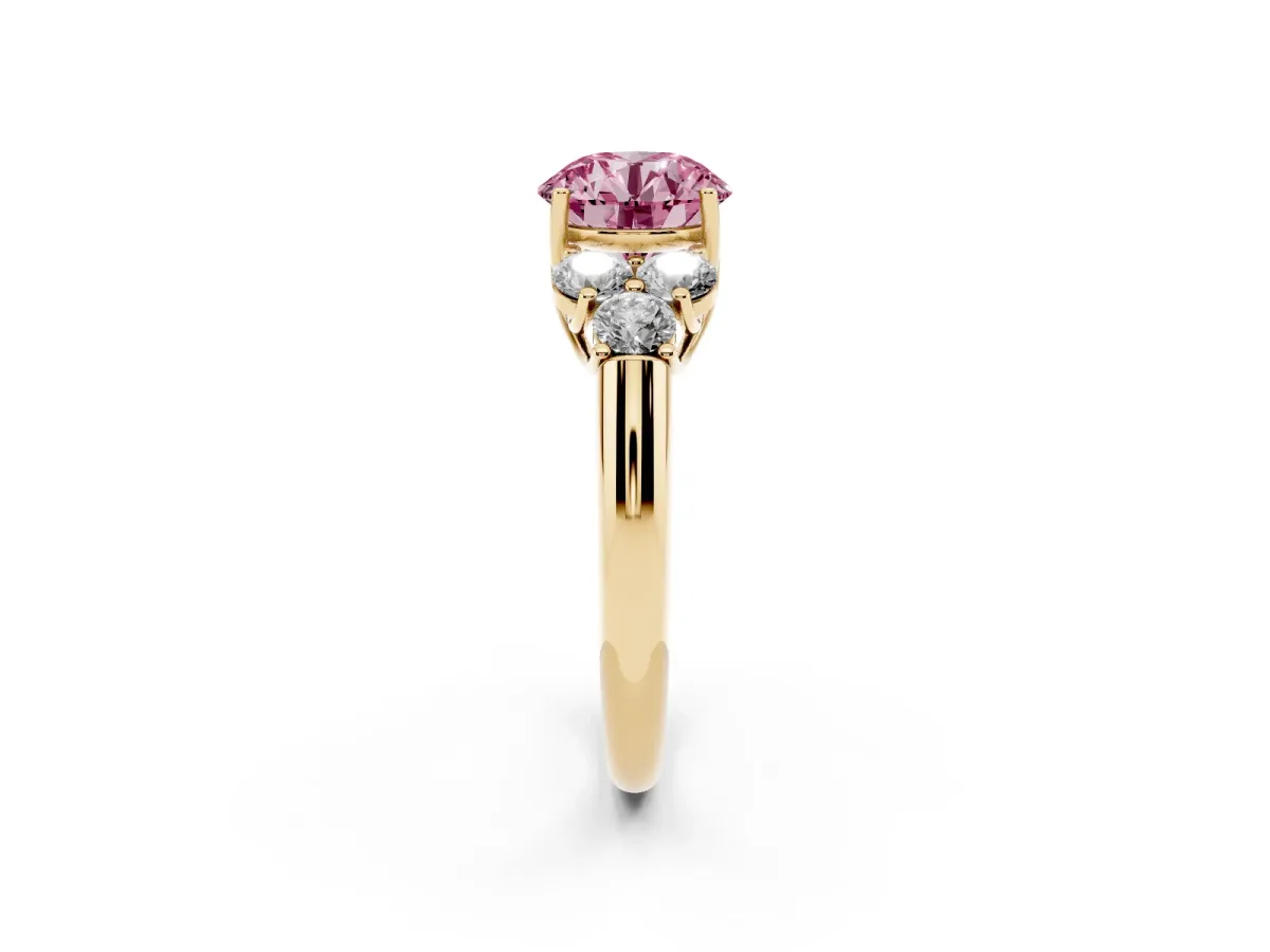 Fancy Pink Round Cut Cut Diamond Cluster Ring with Round Accent Stones and Prong Setting on a Classic Band Yellow gold