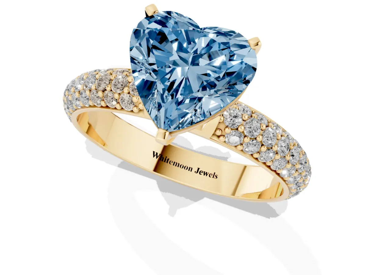 Fancy Blue Heart Cut Diamond Solitaire Ring with Prong Setting and Pavé Band Yellow gold