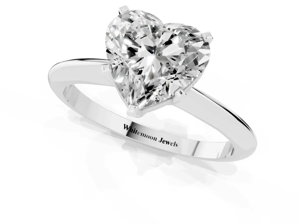 Heart Cut Cut Solitaire Ring with Four-Prong Setting on a Classic Band Silver