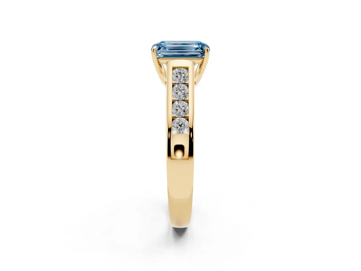 Fancy Blue Emerald Cut Brilliant Channel-Set Solitaire Ring with Four-Prong Setting Yellow gold