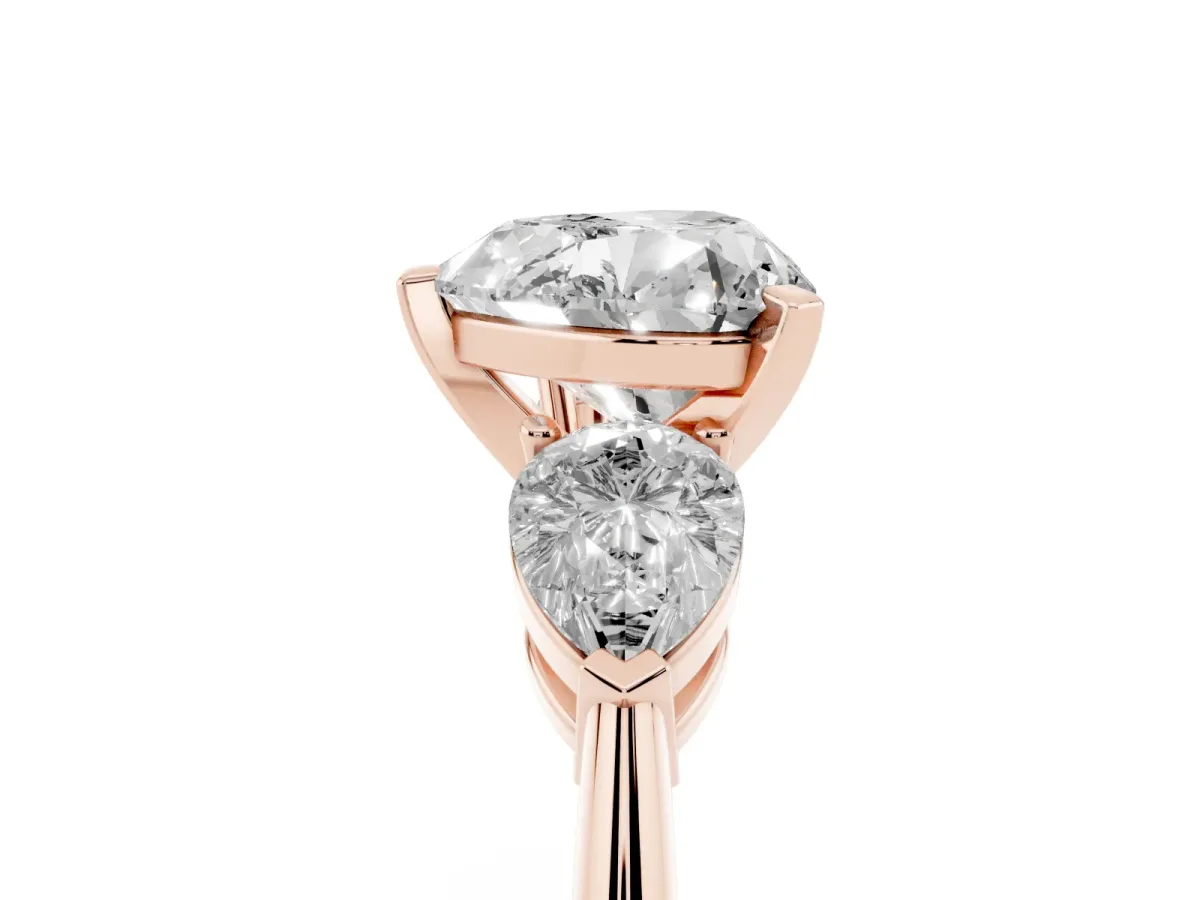 Three-Stone Heart Cut Diamond Ring with Pear Side Stones and Four-Prong Setting Rose gold