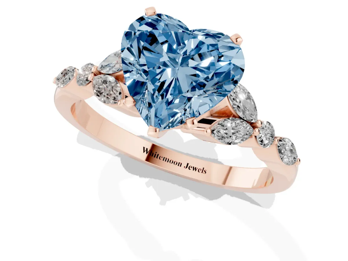 Fancy Blue Heart Cut Diamond Solitaire Ring with Side Stones and Four-Prong Setting Rose gold