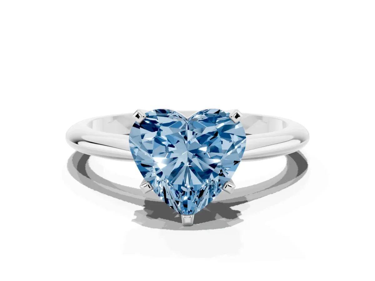 Fancy Blue Heart Cut Cut Solitaire Ring with Four-Prong Setting on a Classic Band Silver