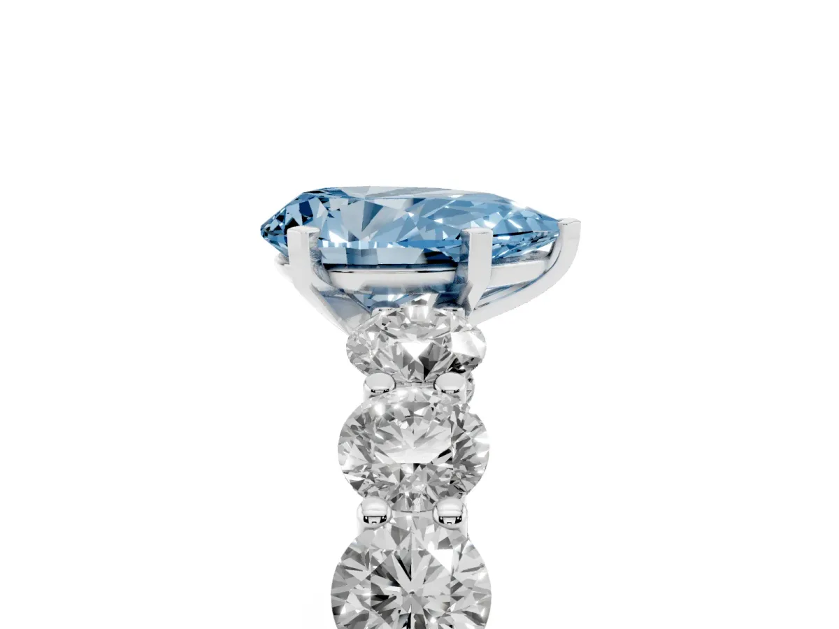 Fancy Blue Pear Cut Diamond Prong Setting with Side Stones on a Pave Band Platinum