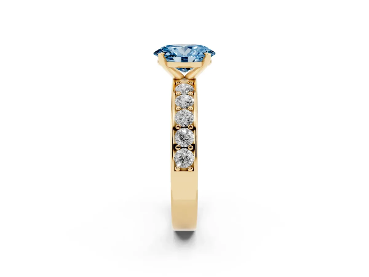 Fancy Blue Oval Cut Diamond Engagement Ring with Channel Set Round Band and Prong Setting Yellow gold