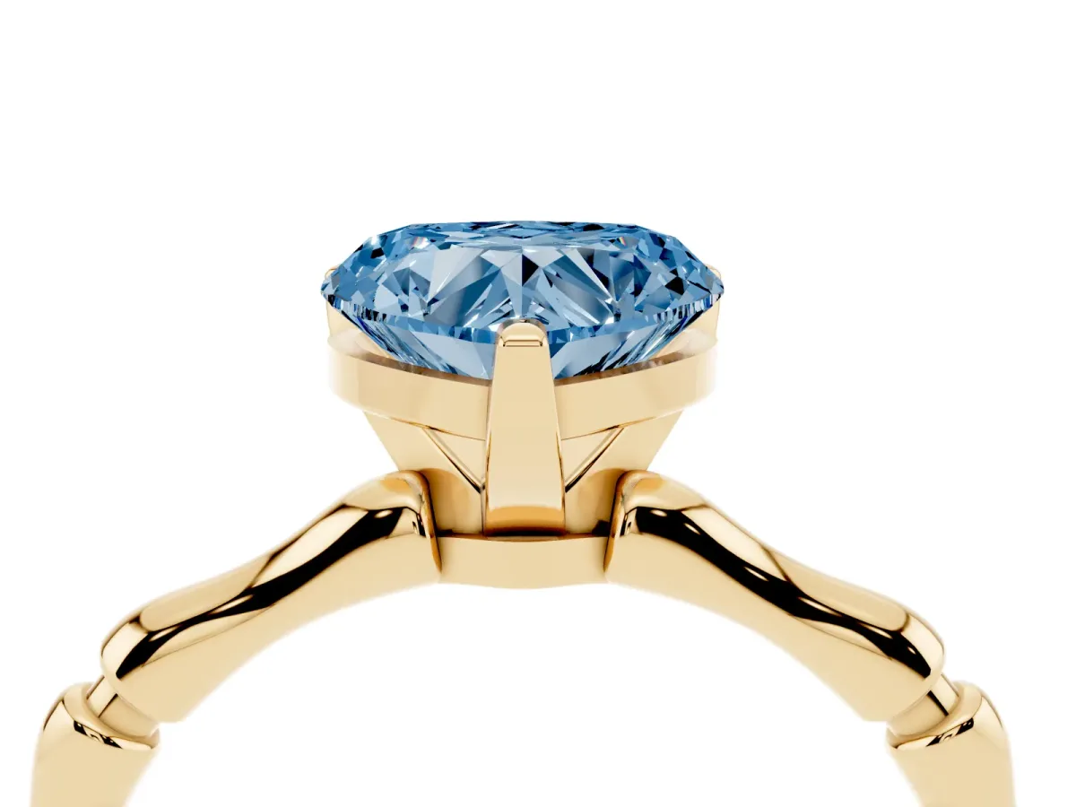 Fancy Blue Heart Cut Solitaire Diamond Ring with Bamboo Band and Four-Prong Setting Yellow gold