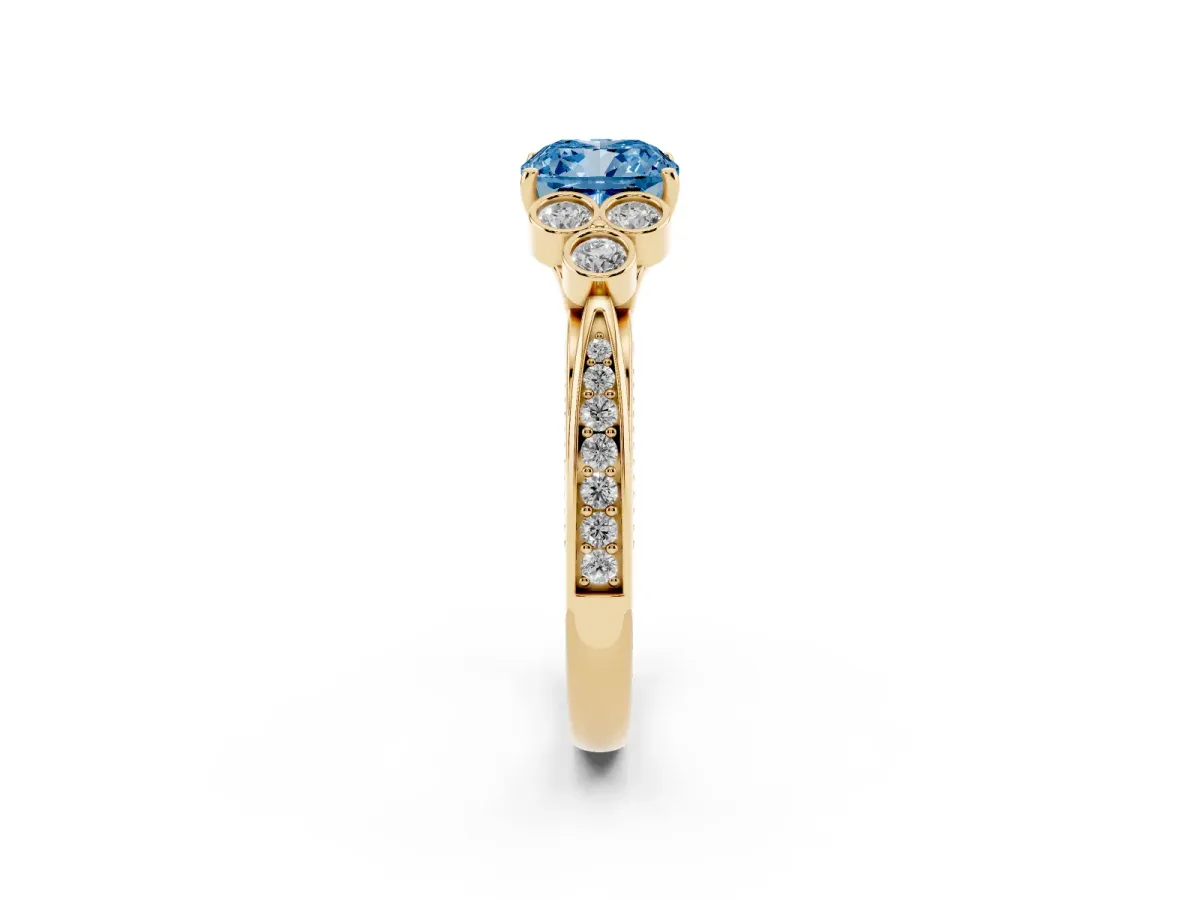 Fancy Blue Cushion Cut Cut Diamond Engagement Ring with Bezel Set Round Side Stones and Prong Setting Yellow gold