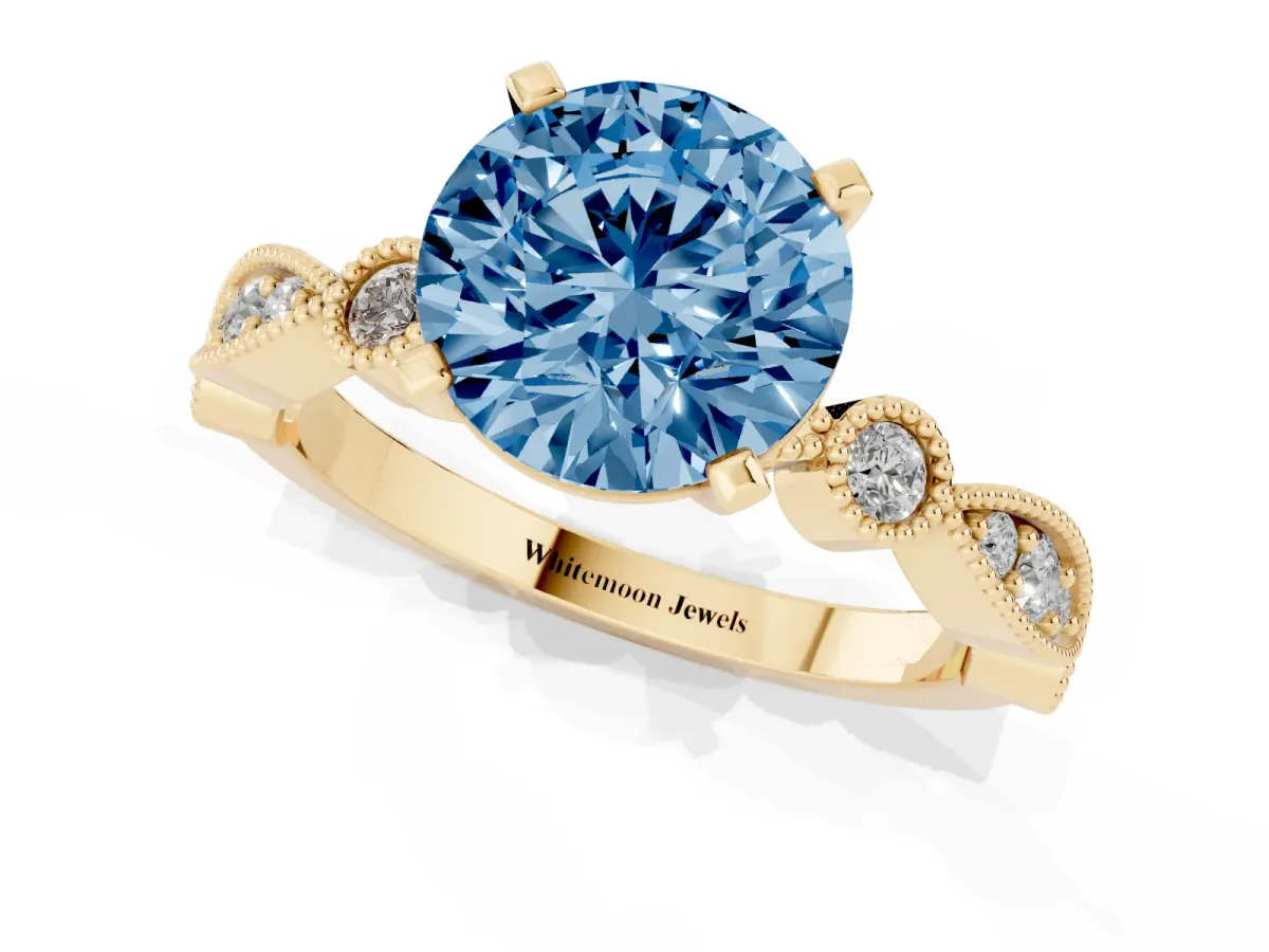 Fancy Blue Round Cut Milgrain Bezel Diamond Engagement Ring with Solitaire Prong Setting Yellow gold