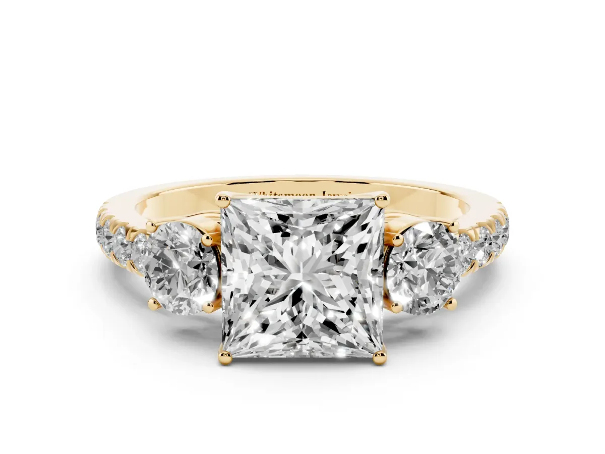 Princess Cut Cut Diamond Three-Stone Ring with Round Side Stones and Pavé Band Yellow gold