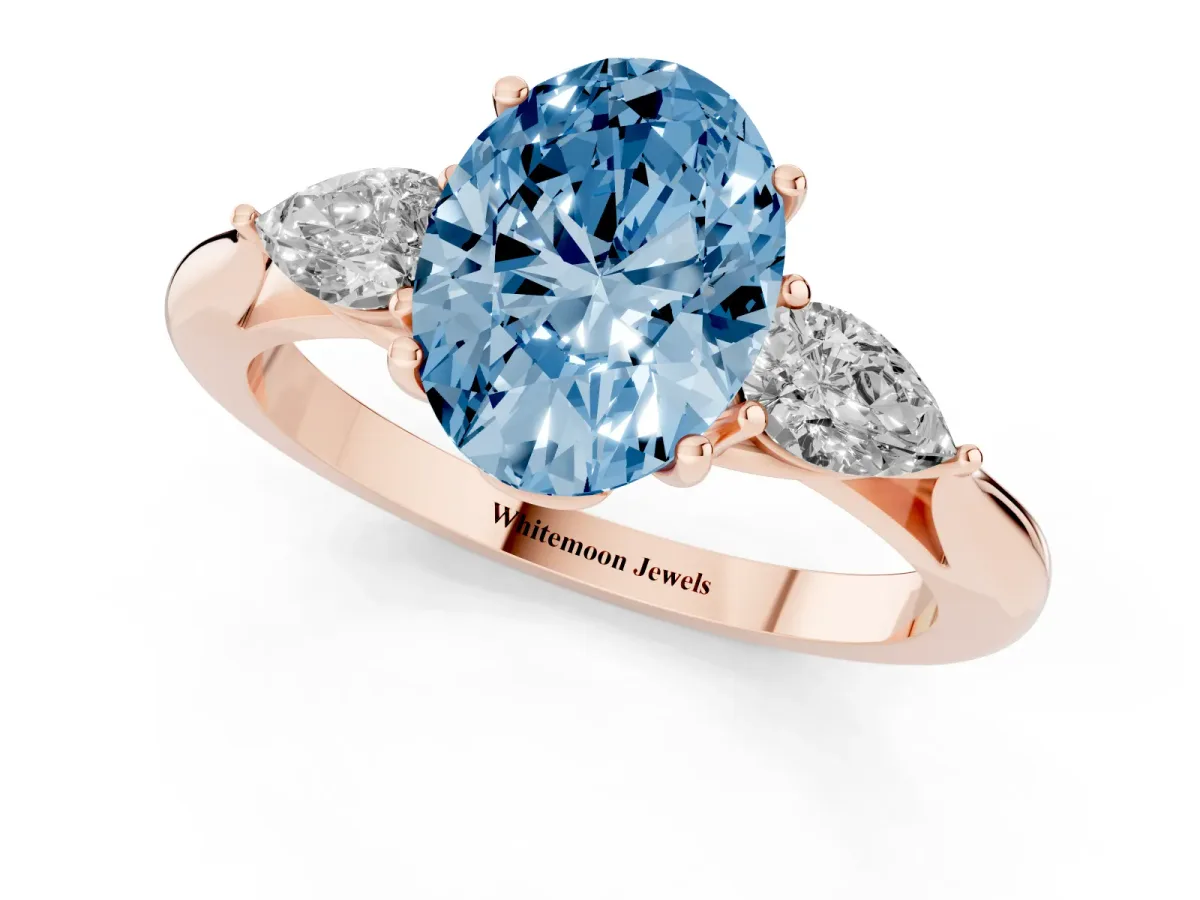 Fancy Blue Oval Cut Diamond Three-Stone Ring with Pear Side Stones and Prong Setting Rose gold