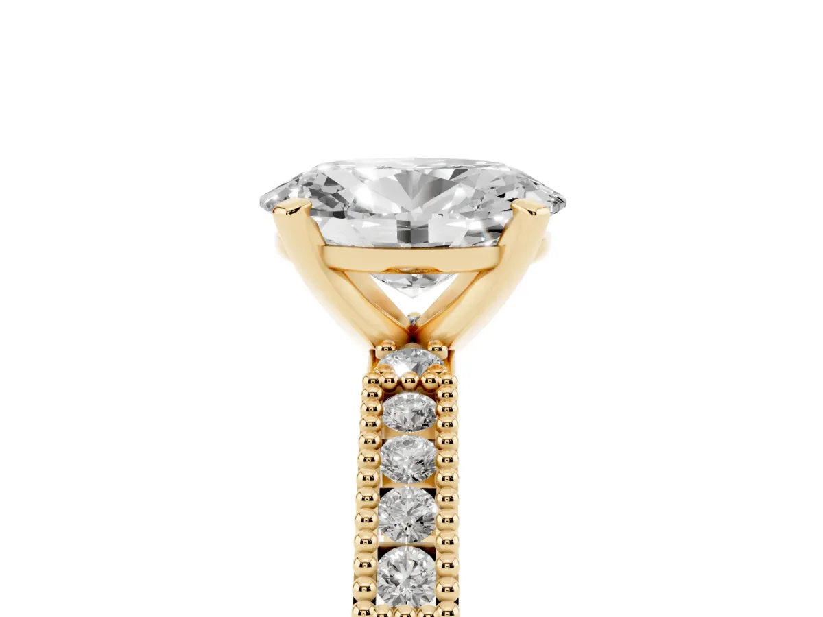 Oval Cut Solitaire with Pavé Band and Four-Prong Setting Yellow gold