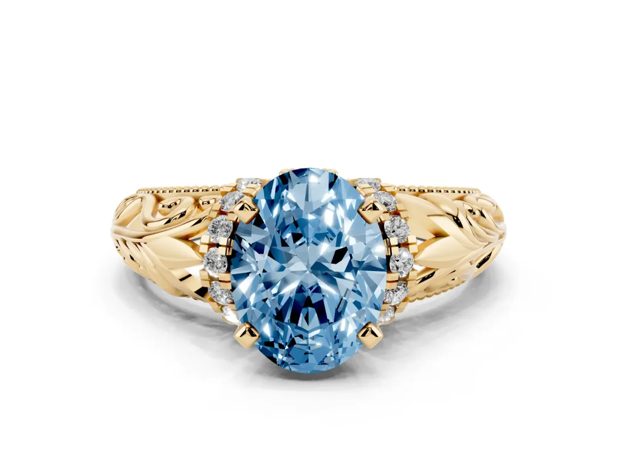 Fancy Blue Oval Cut Solitaire Filigree Engagement Ring with Halo and Prong Setting Yellow gold