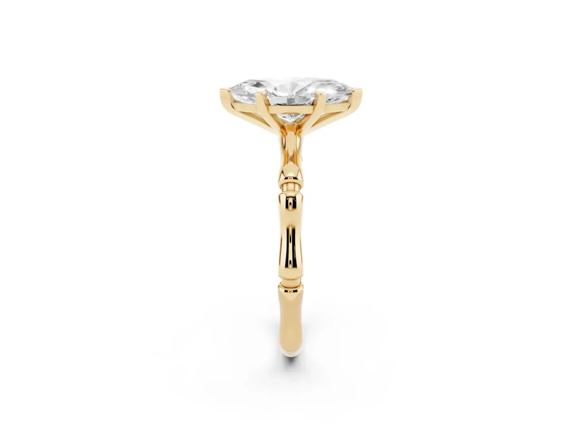 Marquise Cut Solitaire Diamond Ring with Bamboo Band and Four-Prong Setting Yellow gold