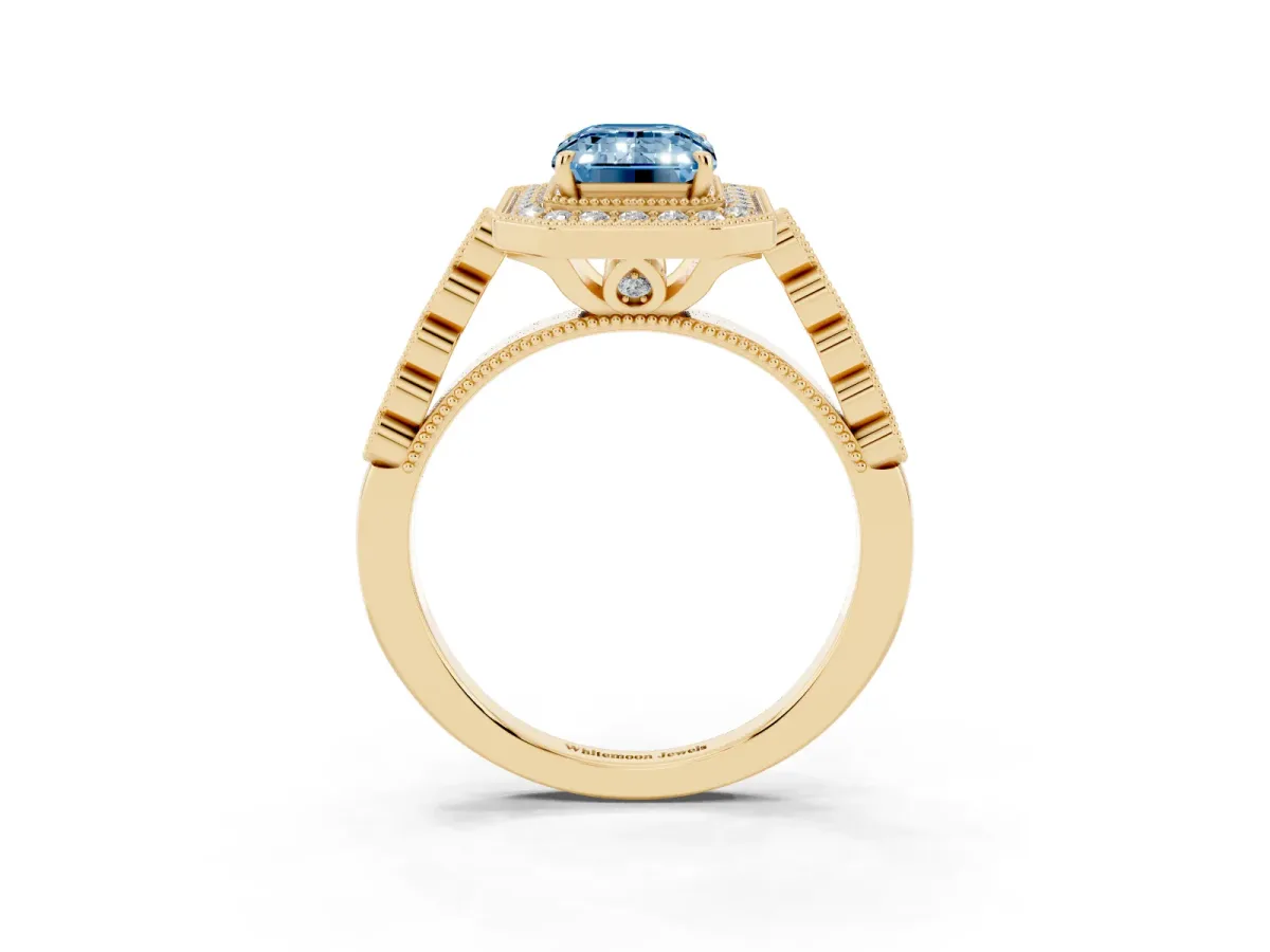 Fancy Blue Emerald Cut Halo Milgrain Solitaire with Bezel Set Side Stones and Pave Band Yellow gold