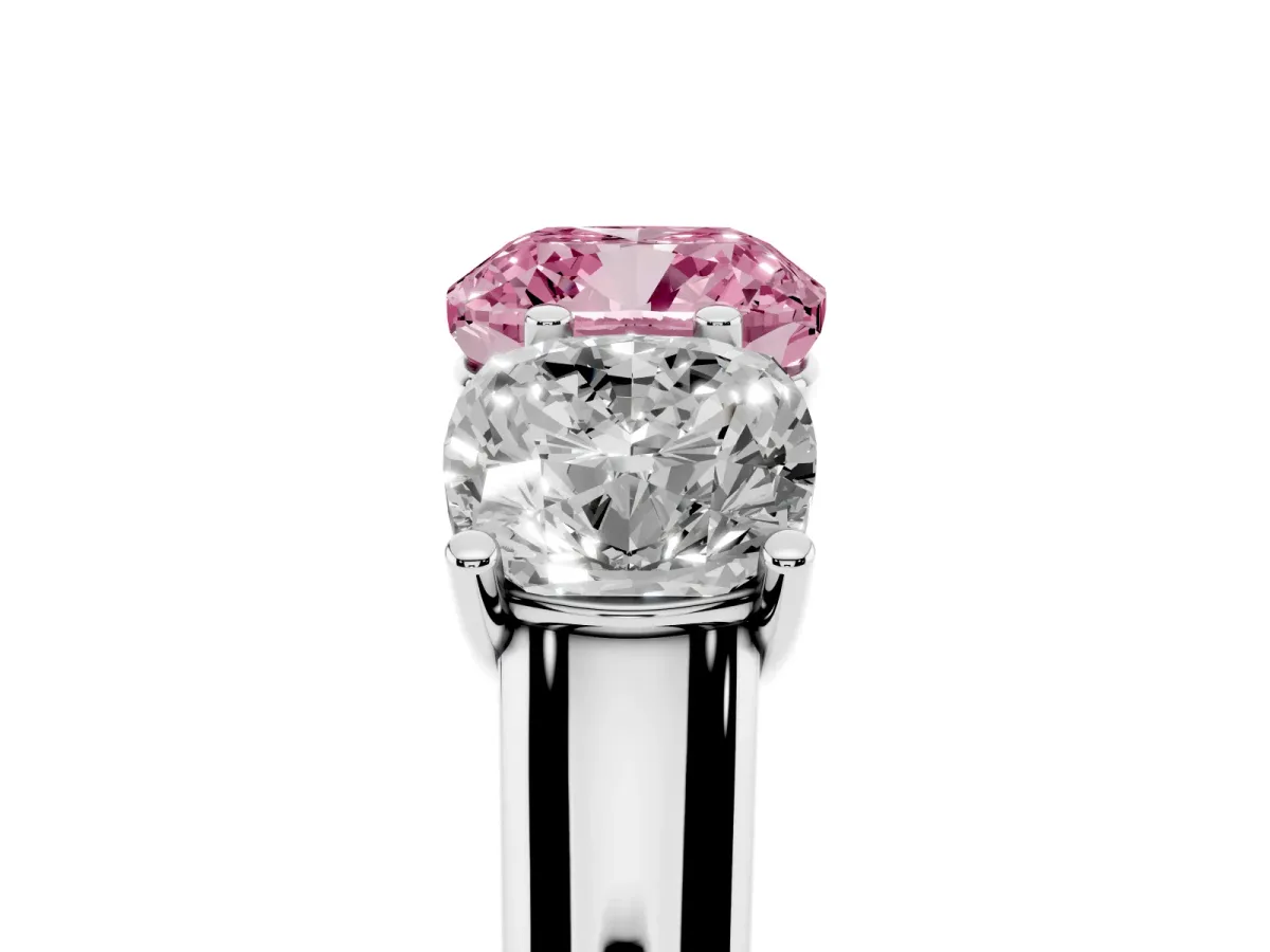 Fancy Pink Cushion Cut Three-Stone Diamond Ring with Prong Setting on a Classic Band Platinum